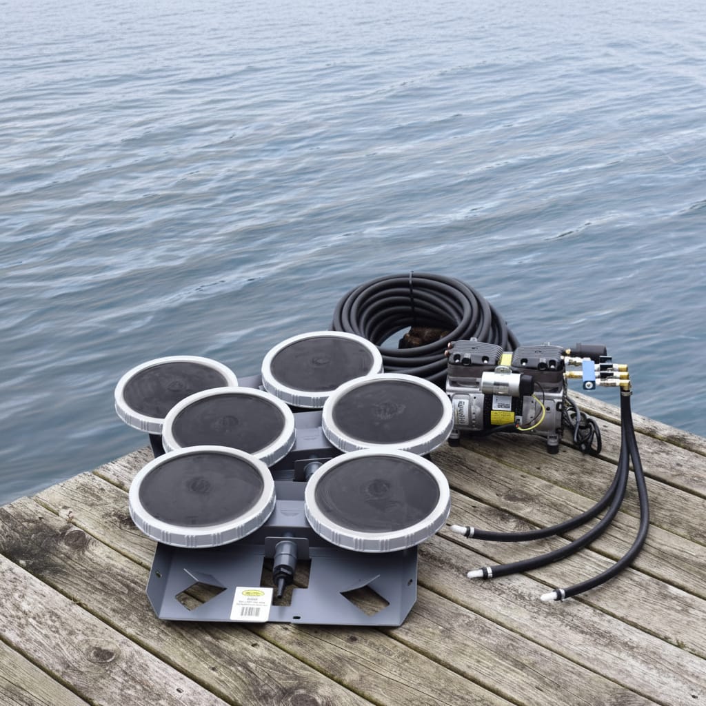 Fish Pond Aeration System components with triple diffuser and compressor on a wooden dock by water.